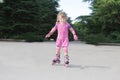 Young happy girl riding roller blades Royalty Free Stock Photo