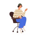 Young happy girl sitting in wheeled armchair. Modern employee, trendy creative office worker in chair, greeting smb with