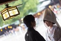 Young happy groom and bride during japanese traditional wedding ceremony at Meiji-jingu shrine in Tokyo, Japan on Royalty Free Stock Photo