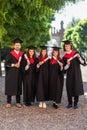 Young happy group of university graduates at graduation ceremony Royalty Free Stock Photo