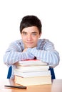 Young happy handsome male student leaning on books Royalty Free Stock Photo