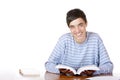Young happy handsome male student read study book Royalty Free Stock Photo