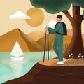 Young happy healthy man hiking tourist with a backpack stands on a background of forest, lake and mountains. The concept Royalty Free Stock Photo