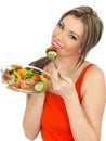 Young Happy healthy Woman Eating a Fresh Mixed Garden Salad Royalty Free Stock Photo