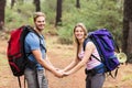 Young happy hiker couple holding hands Royalty Free Stock Photo