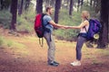 Young happy hiker couple holding hands Royalty Free Stock Photo