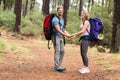 Young happy hiker couple holding hands Royalty Free Stock Photo