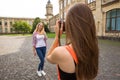 Young happy hipster teenage girls taking pictures and having fun in summer park Royalty Free Stock Photo
