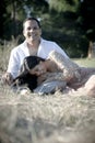 Young happy Indian couple laughing in field Royalty Free Stock Photo