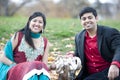 Young Happy Indian Couple Posing With Elephant Royalty Free Stock Photo