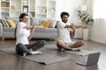 Young Happy Indian Couple Training Together In Front Of Laptop At Home Royalty Free Stock Photo