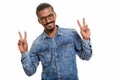 Young happy Indian man giving peace sign Royalty Free Stock Photo