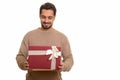 Young happy Indian man opening gift box ready for Valentine`s da Royalty Free Stock Photo