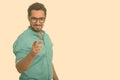 Young happy Indian man pointing finger at camera Royalty Free Stock Photo