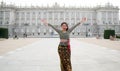 Young happy Indonesian woman from Bali having vacation in Europe - beautiful and cheerful Balinese tourist girl in traditional Royalty Free Stock Photo