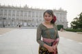 Young happy Indonesian woman from Bali having vacation in Europe - beautiful and cheerful Balinese tourist girl in traditional Royalty Free Stock Photo