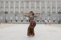 Young happy Indonesian woman from Bali having vacation in Europe - beautiful and exotic Balinese tourist girl dancing in Royalty Free Stock Photo