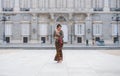 Young happy Indonesian woman from Bali having vacation in Europe - beautiful and exotic Balinese tourist girl dancing in Royalty Free Stock Photo