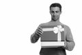 Young happy Iranian man opening gift box ready for Valentine`s day Royalty Free Stock Photo