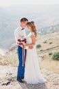 Young happy just married couple posing on the top of the mountain Royalty Free Stock Photo