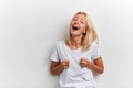 Young happy laughing funny crazy woman showing fico, having fun Royalty Free Stock Photo