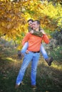 Young happy love couple in autumn park Royalty Free Stock Photo