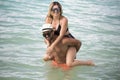 Young happy lovers on romantic travel honeymoon having fun on vacation summer holidays romance.