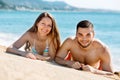 Young happy lovers sunbathing Royalty Free Stock Photo