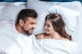 Young happy loving couple in bed Royalty Free Stock Photo