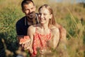 Young happy loving couple embracing and having fun together outdoors. Young couple in love on summer picnic Royalty Free Stock Photo