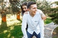 Young, happy, loving couple, frolic and have fun in the Park, and enjoy each other, advertising, and inserting text Royalty Free Stock Photo