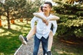 Young, happy, loving couple, frolic and have fun in the Park, and enjoy each other, advertising, and inserting text Royalty Free Stock Photo