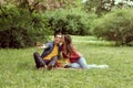 Young, happy, loving couple having date in the park. Relations, friendship and love. Royalty Free Stock Photo