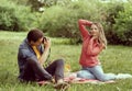 Young, happy, loving couple having date in the park. Relations, friendship and love. Royalty Free Stock Photo