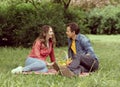 Young, happy, loving couple having date in the park. Relations, friendship and love. Royalty Free Stock Photo