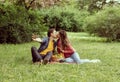 Young, happy, loving couple having date in the park. Relations, friendship and love. Royalty Free Stock Photo