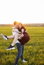 Young, happy, loving couple, outdoors, man holding a girl in his arms , and enjoying each other, advertising, and inserting text Royalty Free Stock Photo