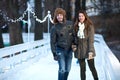 Young happy loving couple skating at ice rink outdoors Royalty Free Stock Photo