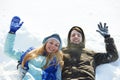 Young happy lying on snow in winter Royalty Free Stock Photo