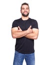 Young happy man with crossed hands in a black t-shirt