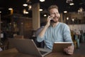 Young happy man having phone call in cafe Royalty Free Stock Photo