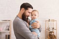 Loving father embracing his cute baby son Royalty Free Stock Photo