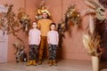 Young happy man hugs two children in identical short sand shoes. brown style Royalty Free Stock Photo