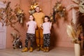 Young happy man hugs two children in identical short sand shoes. brown style Royalty Free Stock Photo