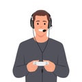 Young happy man playing video game holding joystick and wearing headphone