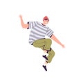 Young happy man in a red hat, striped t-shirt and green jeans cheerfully jumps and laughs Royalty Free Stock Photo