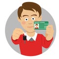 Young happy man showing his car keys and driving license Royalty Free Stock Photo
