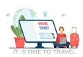 Young happy man sitting with laptop and suitcase and booking tickets online, traveling concept, online shopping concept Royalty Free Stock Photo