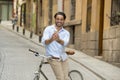 Young happy man taking selfie with mobile phone on retro cool vintage bike Royalty Free Stock Photo