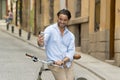 Young happy man taking selfie with mobile phone on retro cool vintage bike Royalty Free Stock Photo